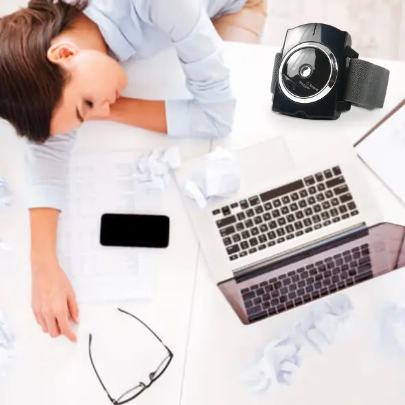 lady sleeping on desk with SnoreFix